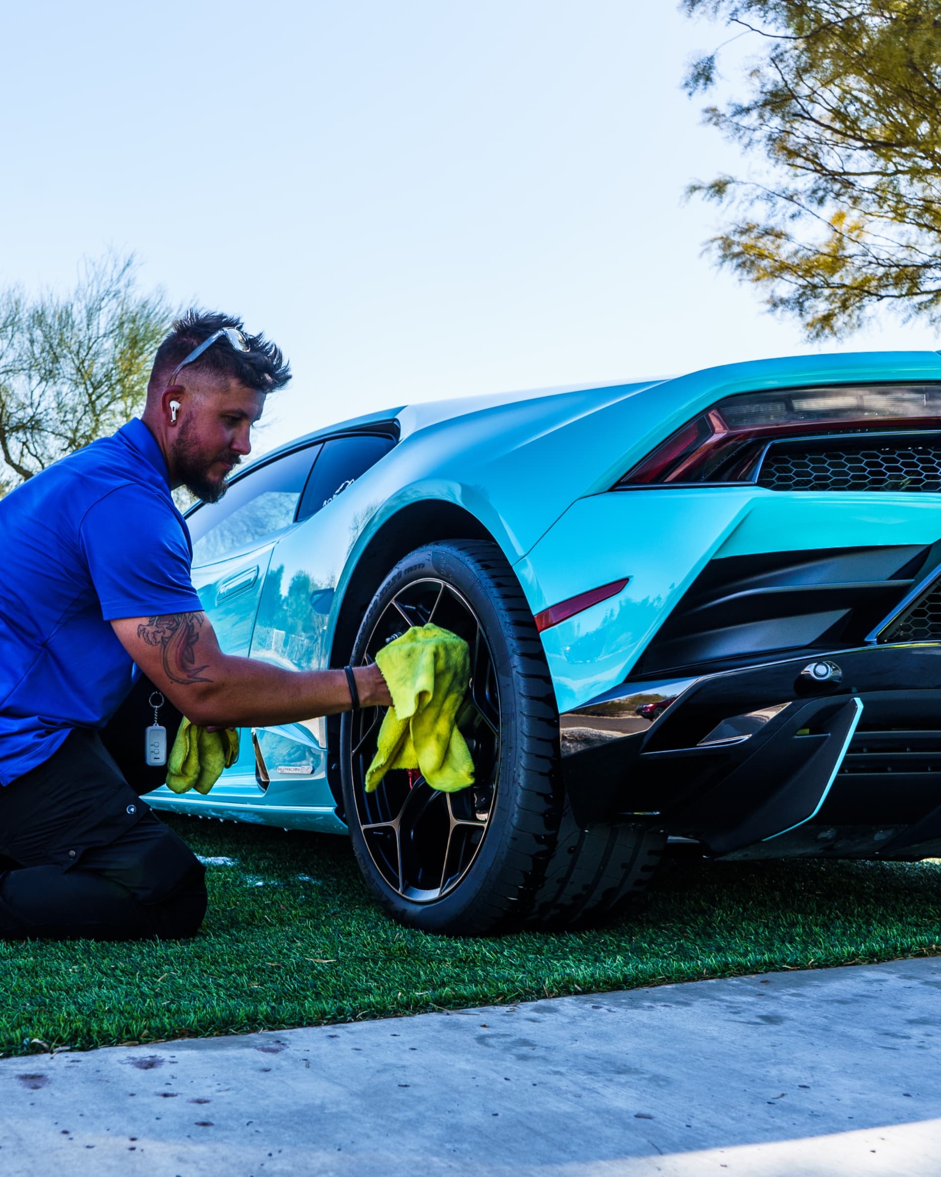 Spotless Detail technician hand-finishing a Lamborghini during a full mobile detail in Scottsdale, AZ